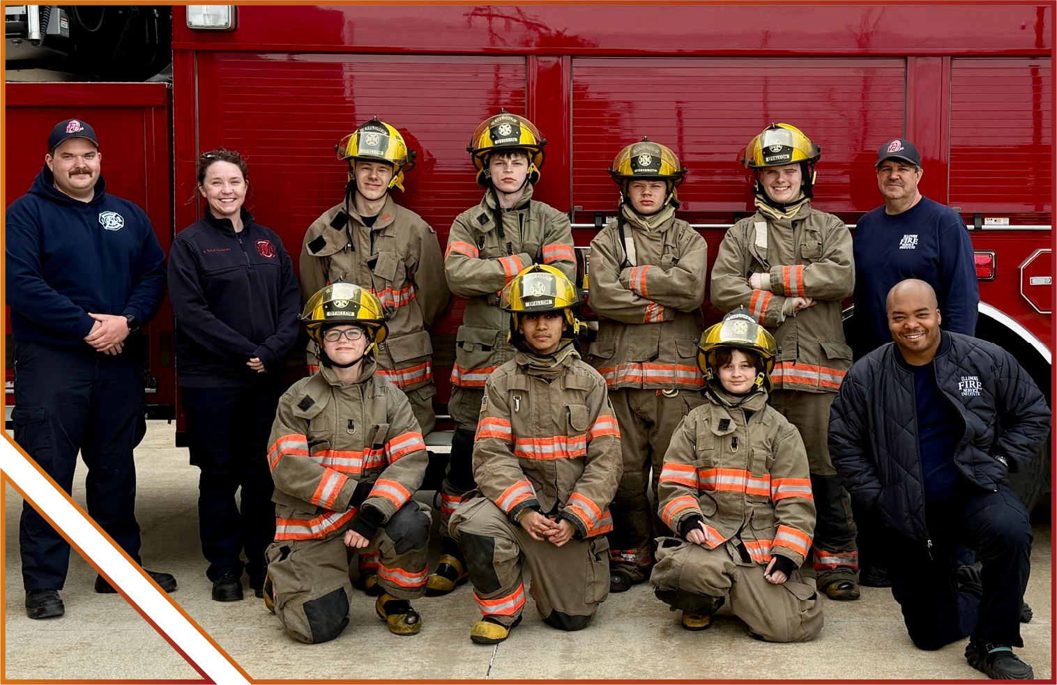 O'Fallon Fire Explorer Post Participants wearing firefighting gear and standing in front of firetruck